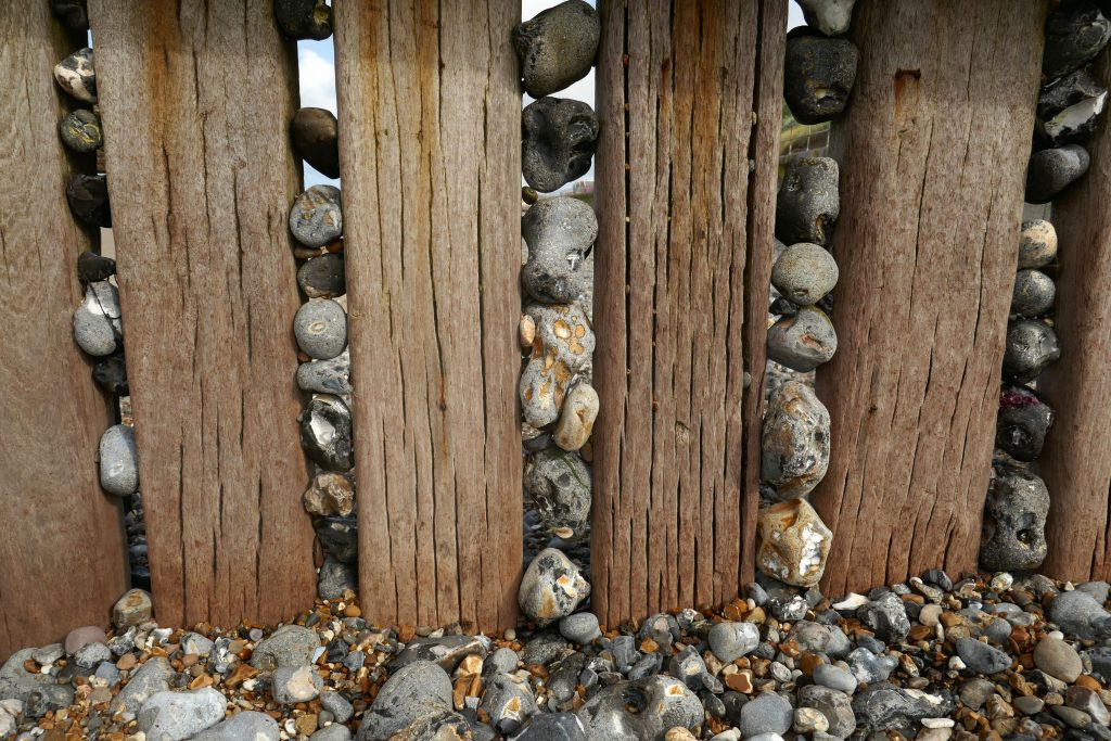 Flint pebbles in wooden groyne at cromer, norfolk